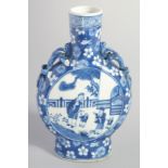 A CHINESE BLUE AND WHITE PORCELAIN MOONFLASK, with moulded handles and painted with figures, mark to