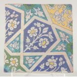 A 19TH CENTURY NORTH INDIAN MULTAN POTTERY TILE, 23cm square.