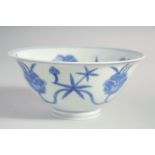 A CHINESE BLUE AND WHITE MING STYLE BOWL, the interior and exterior painted with flower heads,