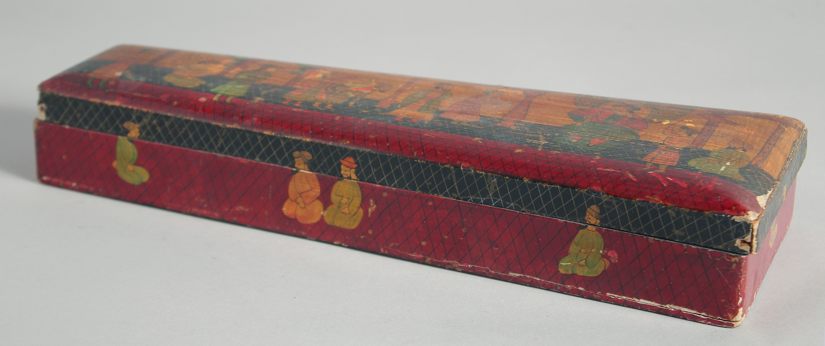 AN INDIAN PAPIER MACHE BOX, painted with a dignitary and attendants, 33.5cm long. - Image 2 of 2