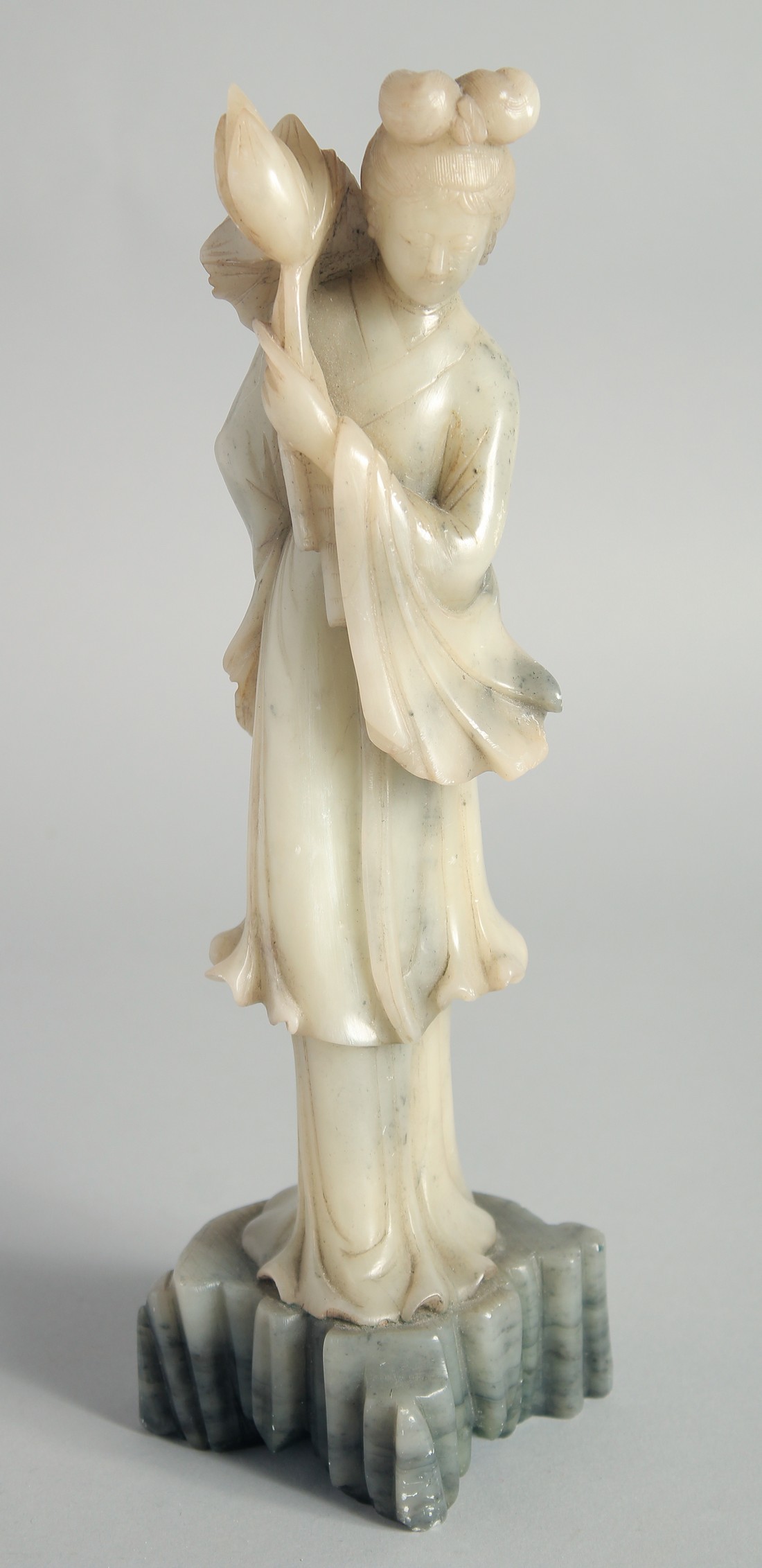 A CHINESE CARVED JADE FIGURE OF GUANYIN, 29cm high.