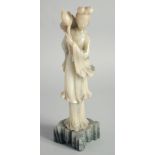 A CHINESE CARVED JADE FIGURE OF GUANYIN, 29cm high.