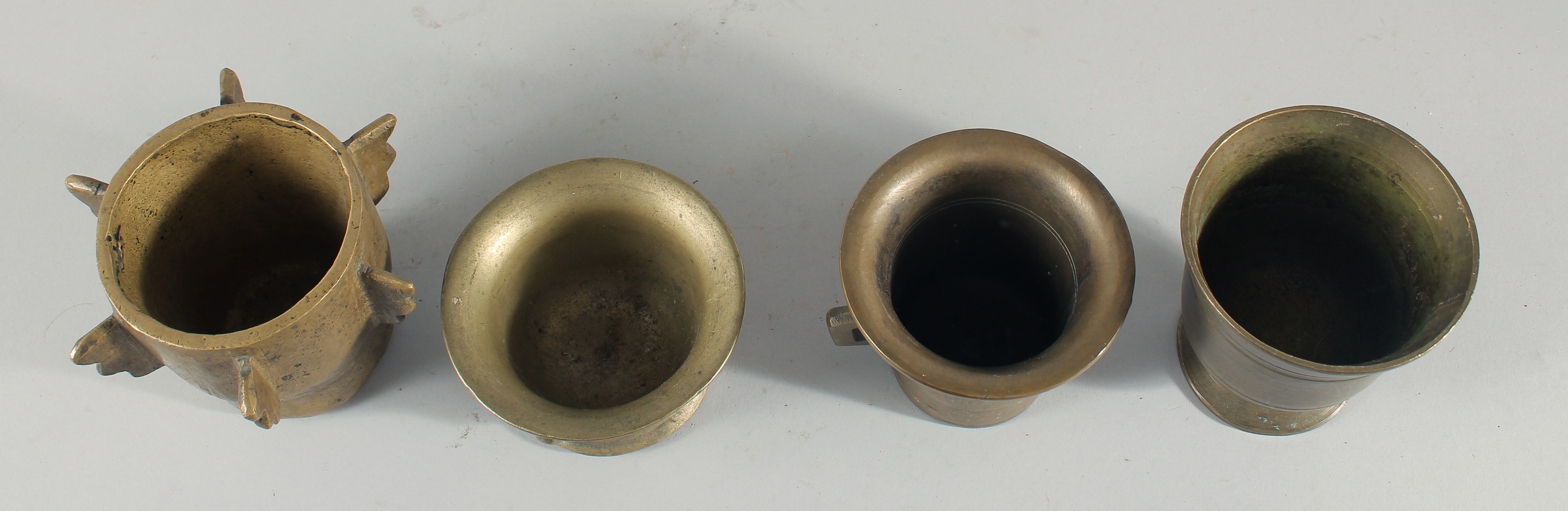A COLLECTION OF FOUR BRONZE PESTLE AND MORTARS, (eight pieces). - Image 3 of 5