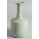 A CHINESE CRACKLE GLAZED CELADON BOTTLE VASE, 23.5cm high.