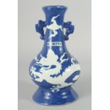 A CHINESE SACRIFICIAL BLUE AND WHITE TWIN HANDLE DRAGON VASE, 29cm high.