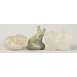 TWO EARLY ISLAMIC CARVED ROCK CRYSTAL ANIMAL FORM BEADS, together with another cat shape bead, (3).