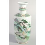 A CHINESE FAMILLE VERTE PORCELAIN VASE, painted with a figure stood within a vast landscape scene,