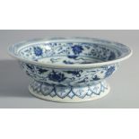 A CHINESE BLUE AND WHITE PORCELAIN DRAGON AND LOTUS BOWL, 21cm diameter.