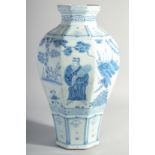 A LARGE CHINESE BLUE AND WHITE GLAZED POTTERY VASE, painted with figures and flora, 42cm high.