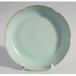 A CHINESE CELADON PETAL FORM DISH, together with collection box, dish inscribed to the base, 14cm