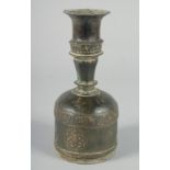 A 13TH CENTURY SELJUK ROSEWATER SPRINKLER, with engraved decoration, 22cm high.