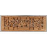 A THAI CARVED AND PIERCED RECTANGULAR WOODEN PANEL, depicting deities, animals and musicians, 73cm x