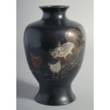 A JAPANESE BRONZE VASE, with mixed metal decoration depicting cockerels, 19cm high.