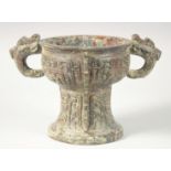 A CHINESE ARCHAIC BRONZE TWIN HANDLE PEDESTAL CENSER, 20.5cm high, 30.5cm handle to handle.