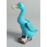 A CHINESE BLUE GLAZE POTTERY FIGURE OF A DUCK, impressed mark to base, 19cm high.