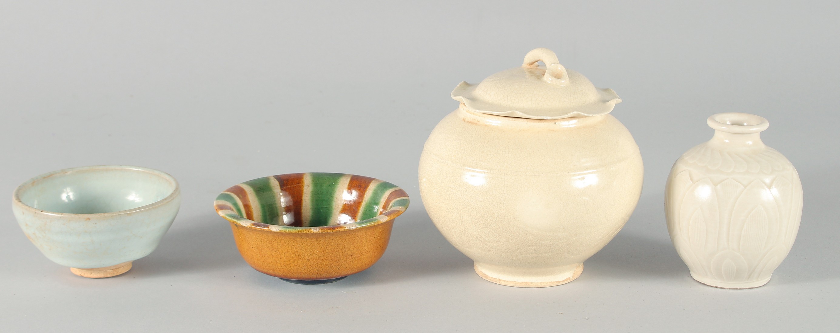 A COLLECTION OF FOUR CHINESE GLAZED POTTERY ITEMS, comprising a jar and cover, a small vase and