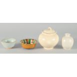 A COLLECTION OF FOUR CHINESE GLAZED POTTERY ITEMS, comprising a jar and cover, a small vase and