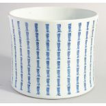 A LARGE CHINESE BLUE AND WHITE PORCELAIN BRUSH POT, with columns of characters, 17cm high.