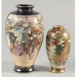 TWO JAPANESE SATSUMA VASES, the larger painted with panels of figures in a landscape, each with