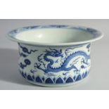 A CHINESE BLUE AND WHITE PORCELAIN BASIN, decorated with dragons, 26cm diameter.