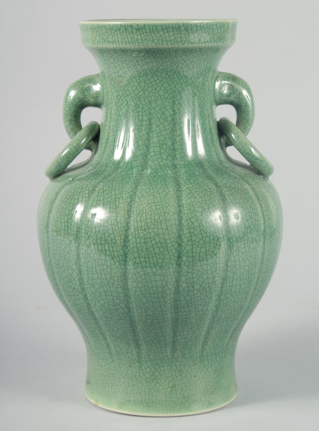 A LARGE CHINESE CELADON CRACKLE GLAZE VASE, with ribbed body and moulded drop ring handles, 30.5cm
