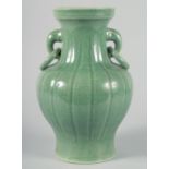 A LARGE CHINESE CELADON CRACKLE GLAZE VASE, with ribbed body and moulded drop ring handles, 30.5cm