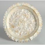 AN INDIAN GOA MOTHER OF PEARL DISH, 19cm diameter.