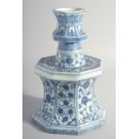 A LARGE CHINESE MING STYLE BLUE AND WHITE PORCELAIN CANDLE STAND, decorated with panels of flora,