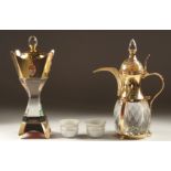 A ROYAL SAUDI GIFT BOX, comprising a glass ewer, two porcelain cups and a glass container.