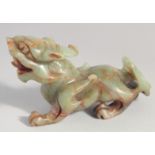 A CHINESE CARVED SOAPSTONE FIGURE OF A DRAGON, 15cm long.