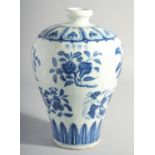 A CHINESE MING STYLE BLUE AND WHITE MEIPING VASE, decorated with various blossoming fruit, 29cm