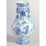 A CHINESE BLUE AND WHITE PORCELAIN VASE, with moulded handles and painted with figures, mark to