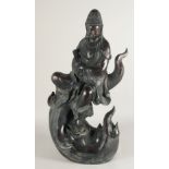 A LARGE CHINESE BRONZE FIGURE OF GUANYIN sitting atop a wave, holding a sceptre, bearing a six-