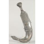 A FINE LARGE 19TH CENTURY RHINO HORN HILTED ARAB YEMENITE SILVER JAMBIYA DAGGER, 34.5cm in sheath.