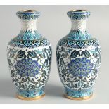 A GOOD PAIR OF BLUE, WHITE AND GREEN CLOISONNE VASES, decorated with intertwined foliate design with