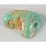 AN EGYPTIAN CARVED TURQUOISE STONE EYE, 5cm wide.