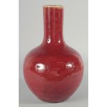 A CHINESE COPPER RED GLAZE VASE, 32cm high.