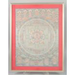 A TIBETAN THANGKA SILVERED WHEEL OF LIFE PAINTING, framed and glazed, 49.5cm x 36.5cm.