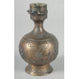 AN EARLY SELJUK SILVER INLAID BOTTLE, possibly 13th century, 12cm high.