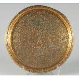 A FINE OTTOMAN TURKISH GILDED COPPER TOMBAK TRAY, with engraved calligraphy and panels of mosques,