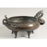 AN IMPRESSIVE 19TH CENTURY JAPANESE BRONZE CENSER, with applied bronze dragons as handles, relief