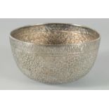 A FINE 19TH CENTURY THAI WHITE METAL BOWL, with embossed and engraved floral motifs, 14.5cm