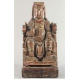 A LARGE 18TH/19TH CENTURY CHINESE HARDWOOD CARVING of an emperor seated upon a throne, with traces