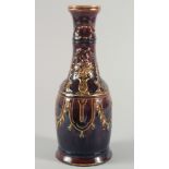 AN UNUSUAL GLAZED POTTERY HUQQA BASE, with gilt painted decoration, 29cm high.