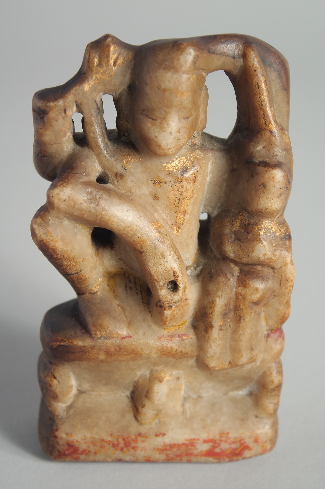 AN INDIAN RAJASTHAN CARVED ALABASTER FIGURE OF A DEITY, with traces of gilt decoration, 12.5cm