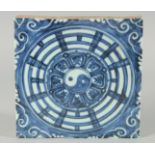 A CHINESE BLUE AND WHITE GLAZE TEMPLE TILE, 19cm x 19.5cm.