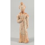 A CHINESE TERRACOTTA FIGURE, 20.5cm high.