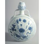 A CHINESE BLUE AND WHITE PORCELAIN TWIN HANDLE MOON FLASK, decorated with a central spray of