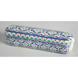 A TURKISH OTTOMAN KUTAHYA POTTERY PEN BOX, 23cm long.