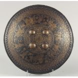 A VERY FINE 19TH CENTURY NORTH INDIAN GOLD OVERLAID CHISELLED STEEL SHIELD, possibly Sikh, decorated